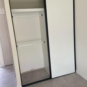 Built in wardrobe , doors- polytec classic white sheen with black alliminum powder coated handle profiles/door tracks ( soft closing drawers and doors